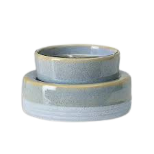 Two ceramic bowls with a blue and beige glaze on a white background