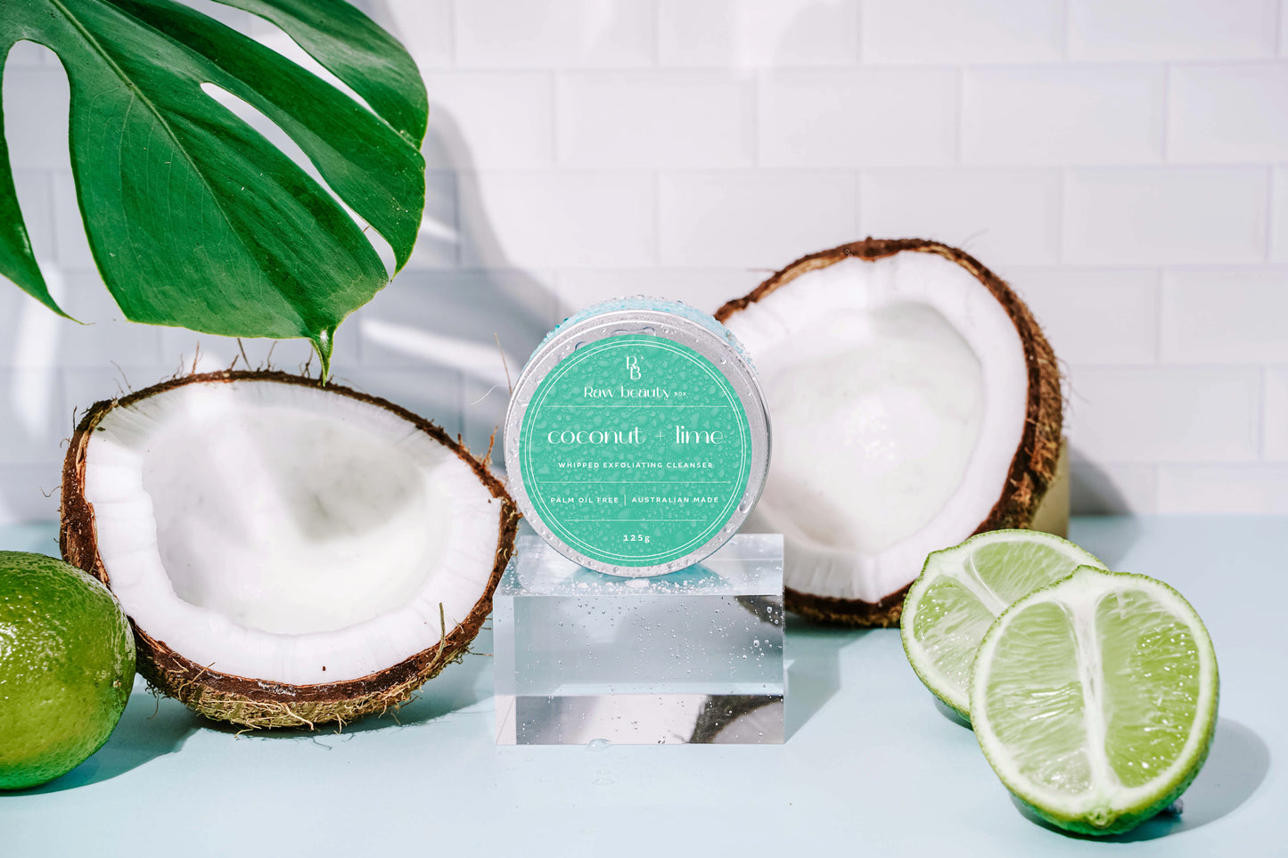 Coconut and lime themed product with coconuts and limes on a light blue background